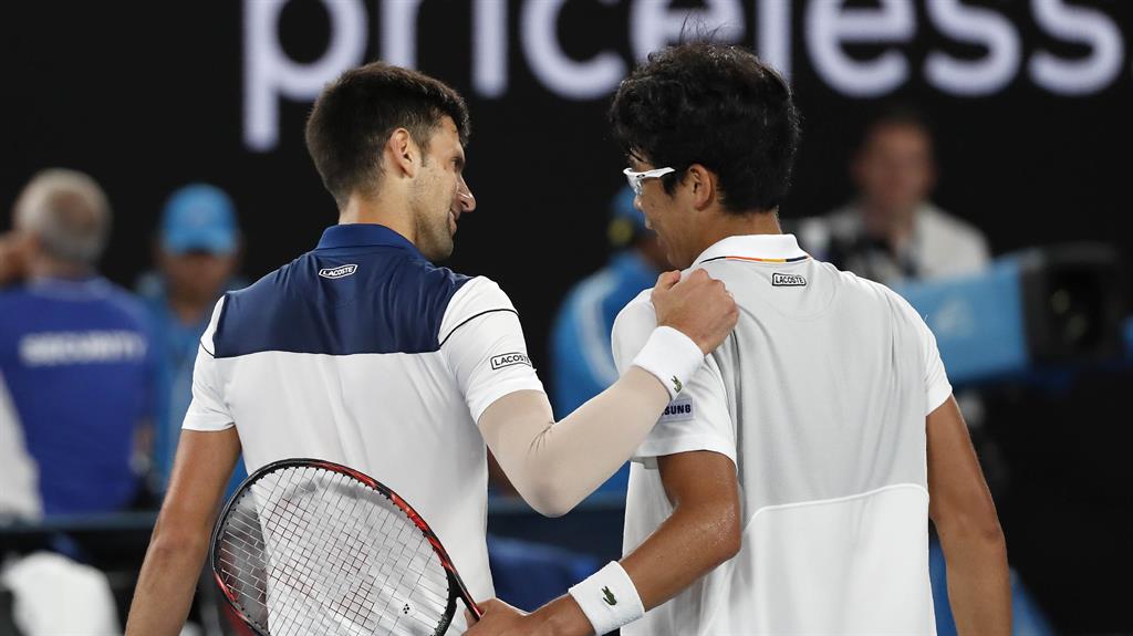 Good work: Djokovic congratulates Chung after the match PICTURES: REUTERS