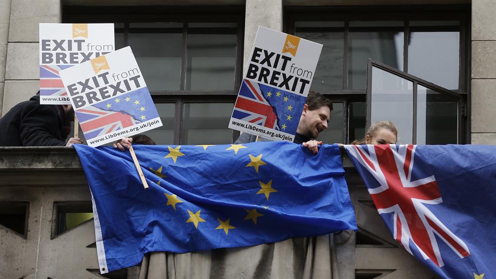 It’s my party: Lib Dem activists stage a balcony protest as Boris Johnson arrives to give his speech PICTURES: AP/GETTY