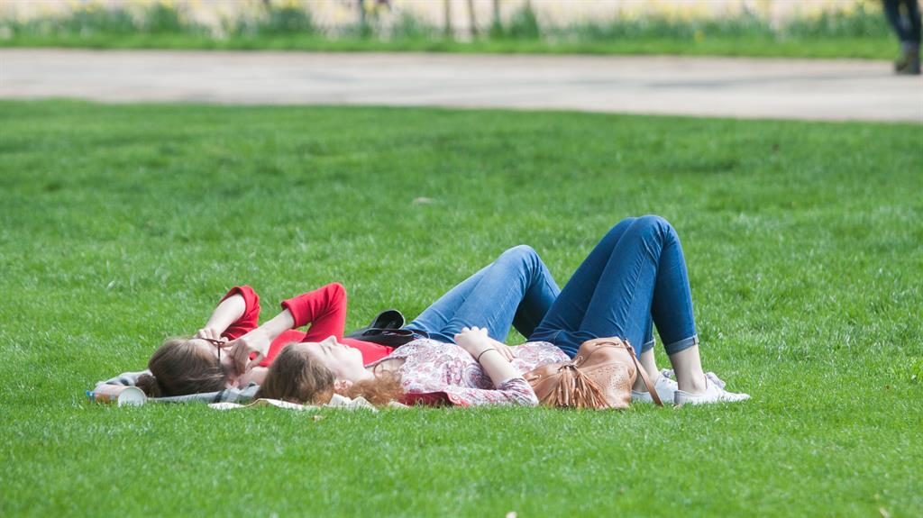 Getting warmer Two sunseekers enjoy the weather in Hyde Park London over the weekend