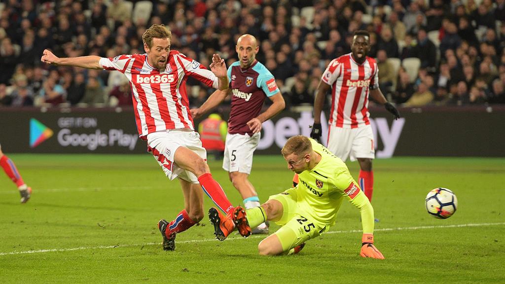 Slip: Stoke's Peter Crouch pounces after Hart spills the ball PICTURE: REX