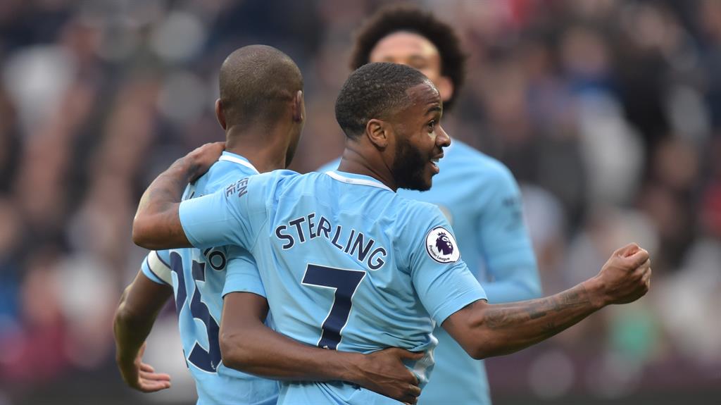 Easy peasy: Raheem Sterling of Manchester City celebrates with goalscorer Fernandinho during a regulation 4-1 win against West Ham PICTURE: REX