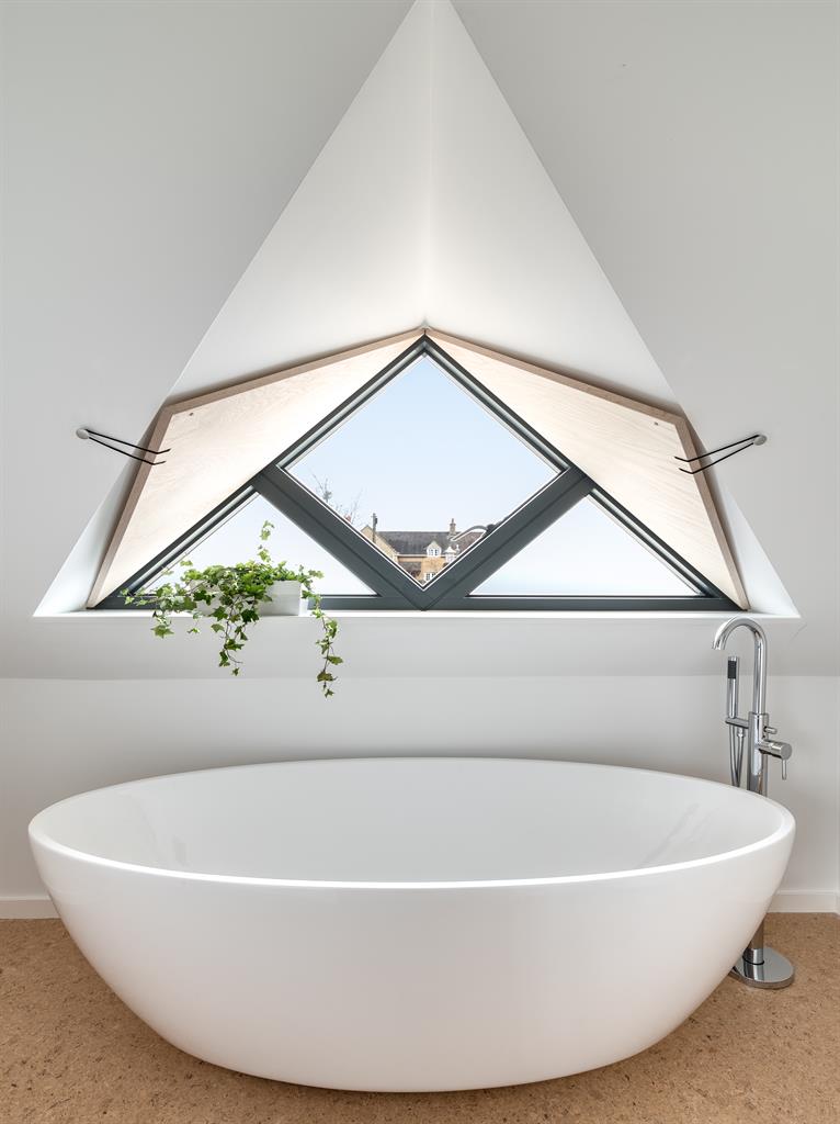 New angles: Specially made features include a triangular dormer, above, and an ash-tread staircase, below