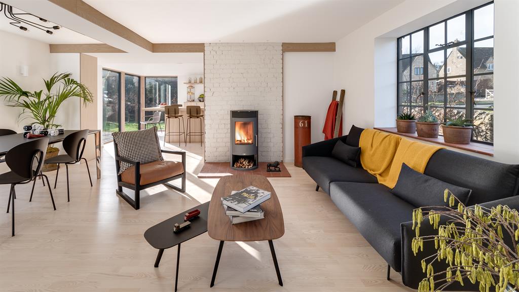 Opening up: Lydia and Lawrence transformed the lounge. Below: How it looked when they moved in