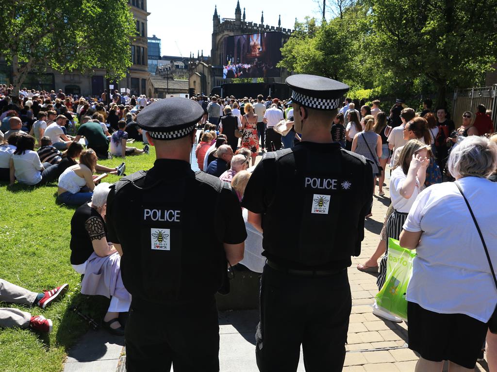 Outdoor screening: Police provide security outside the cathedral