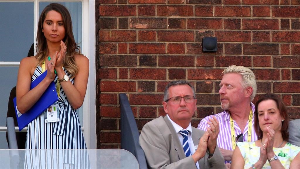 Keep your eyes on
the game: Boris
seems to admire
tennis steward PIC: REX