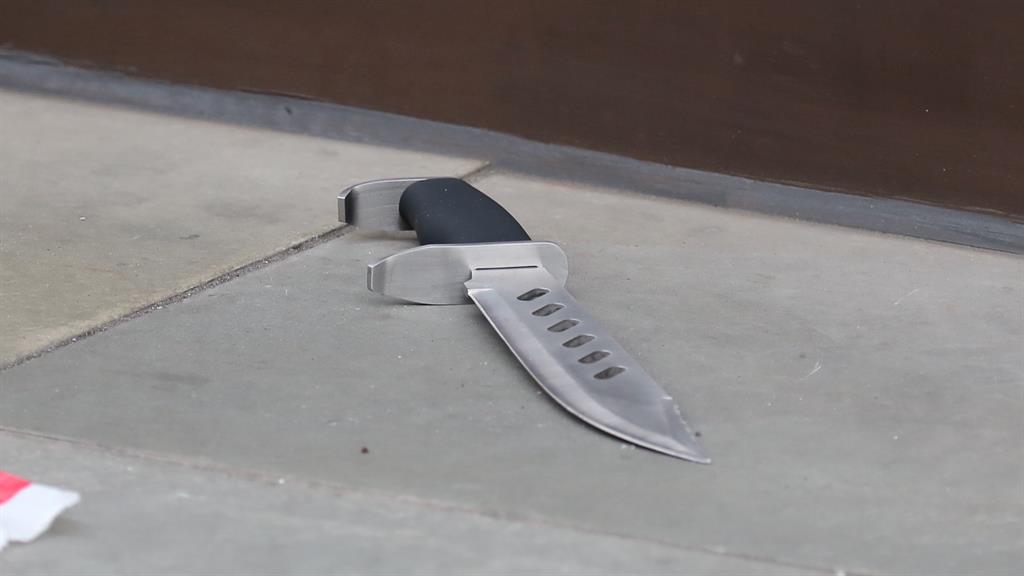Smash and stab: A large knife and hammer (below) left behind after the raid PICS: LONDON NEWS PICTURES