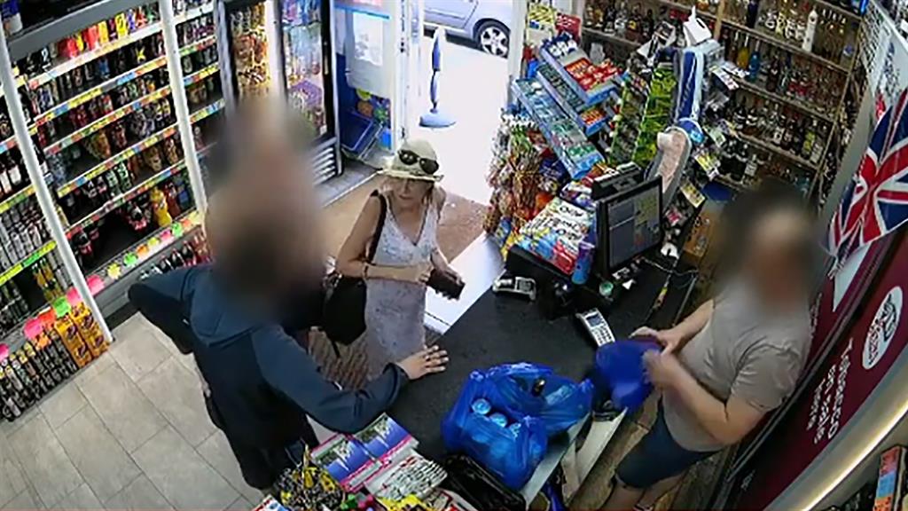Looking well: Dawn Sturgess buys wine and cans of drink with a male friend, and (below) her partner Charlie Rowley stocks up on cans at another Salisbury shop later on Friday