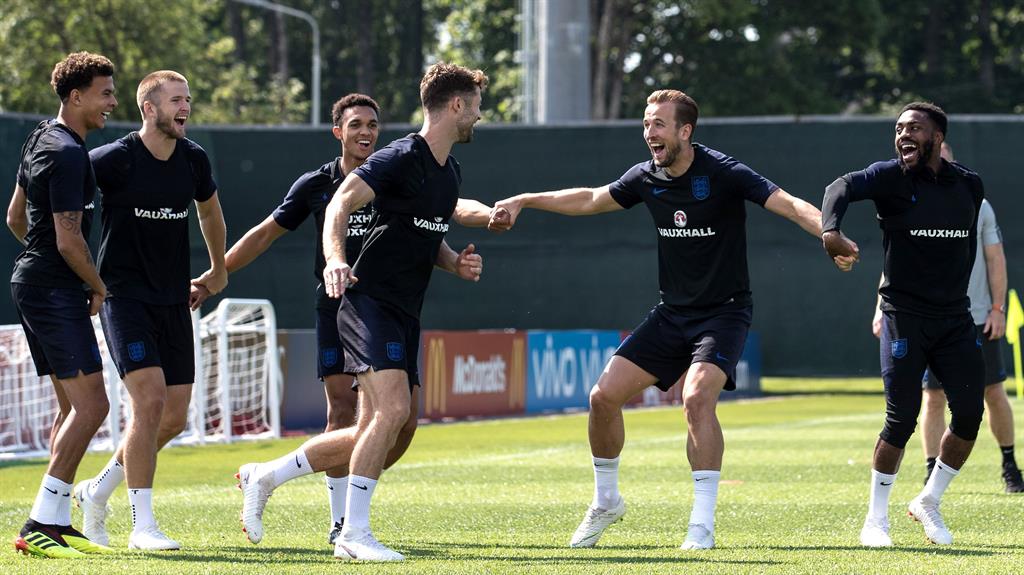 Smiling again: England players look in a positive mood as they prepare for tomorrow's Belgium's game PICTURE: REX