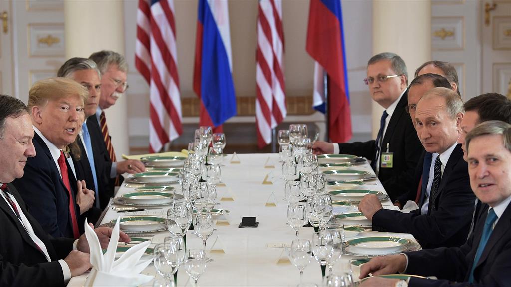 Let's lunch: Russian president Vladimir Putin (third-right) sits opposite US president Donald Trump during their meeting in Helsinki PICTURE: EPA