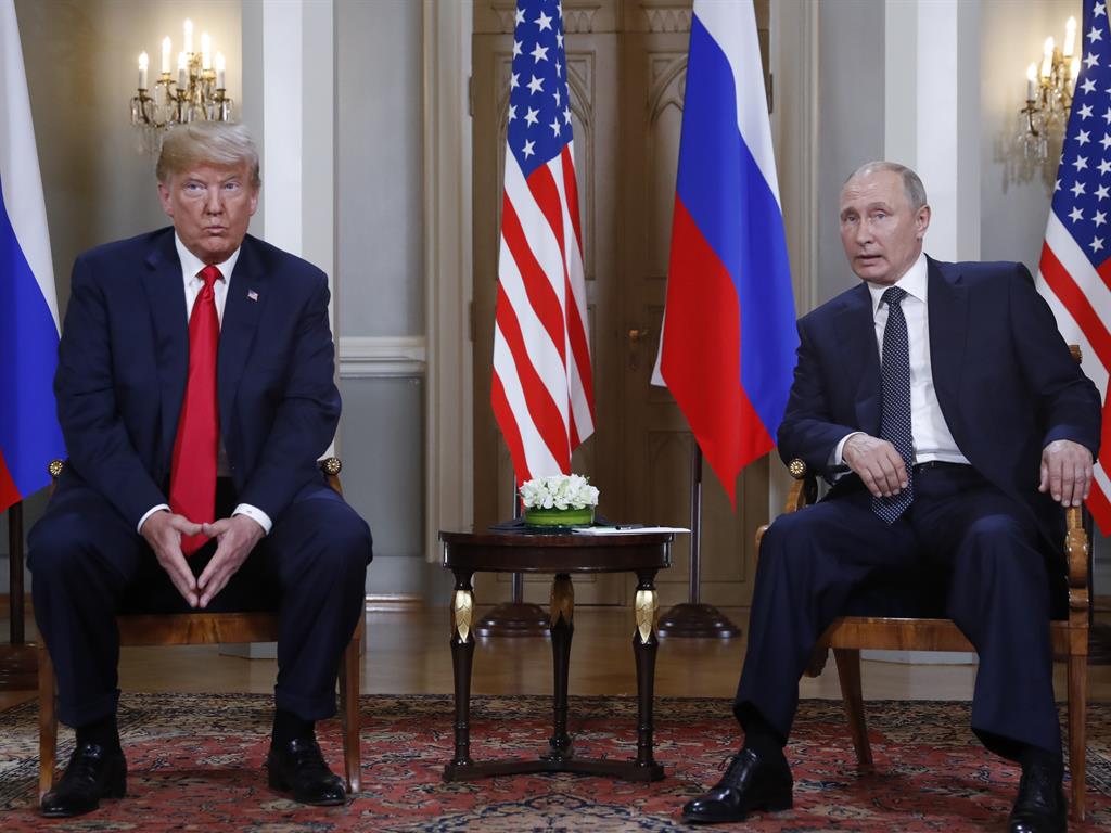 Body language: Donald Trump listens to a statement by Vladimir Putin at the beginning of their Helsinki meeting