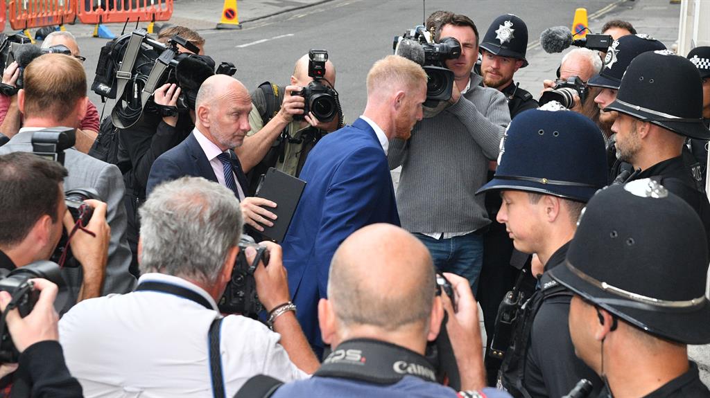 In the thick of it: Ben Stokes (centre) arrives at Bristol Crown Court