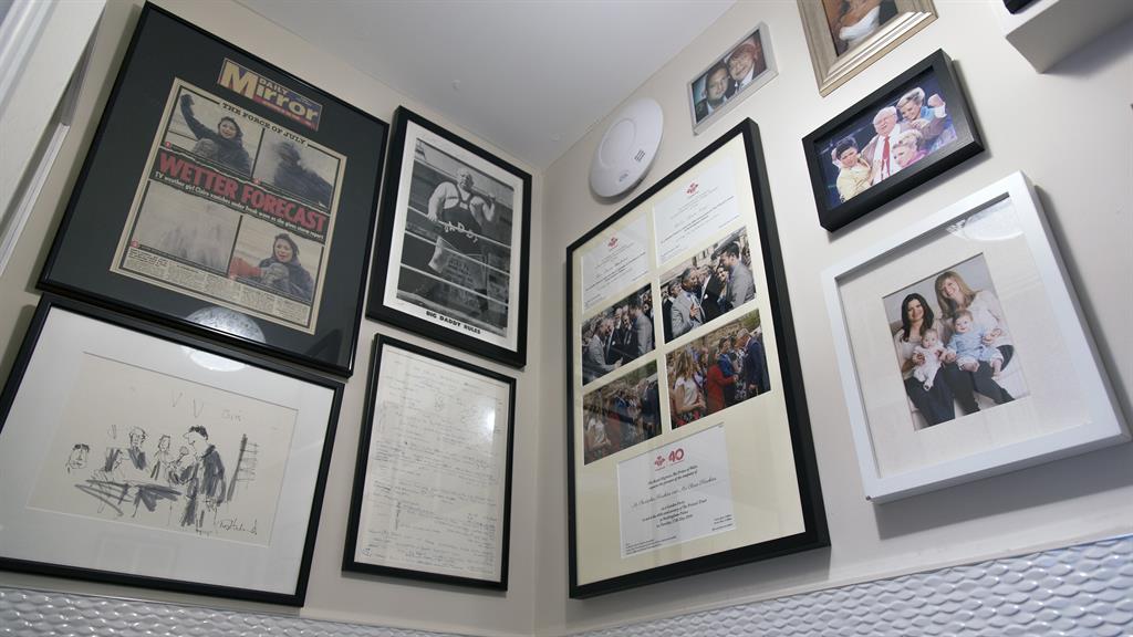 Wall of fame: Clare’s memorabilia includes photos of her with Prince Charles