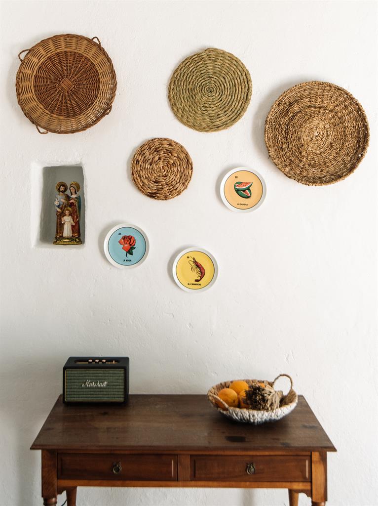 Raffia rules: From decoration on the walls, above, to on the roof terrace, below