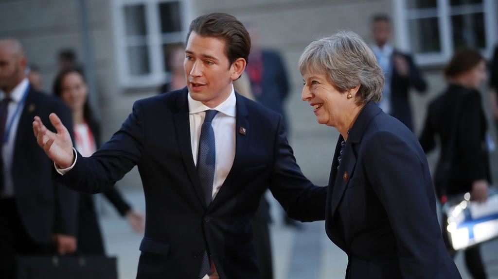 Welcome Theresa May is greeted by Austrian Chancellor Sebastian Kurz in Salzburg last night