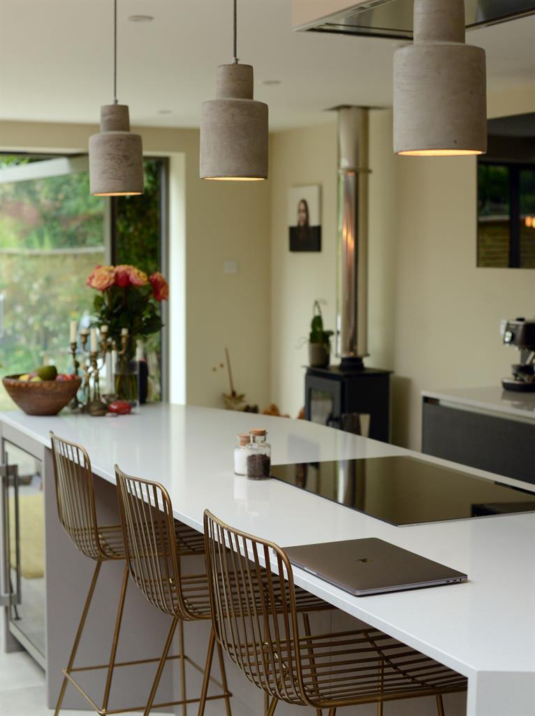 Golden glow: The kitchen lamps were designed with gold and copper inside
