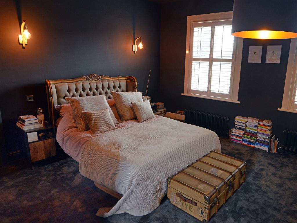 Classic meets contemporary: Remi insisted on dark walls, despite the advice of his builder