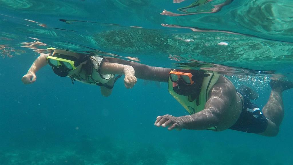 More bad fortune: Dominic's father Len snorkelling with Matilda minutes before he suffered a heart attack