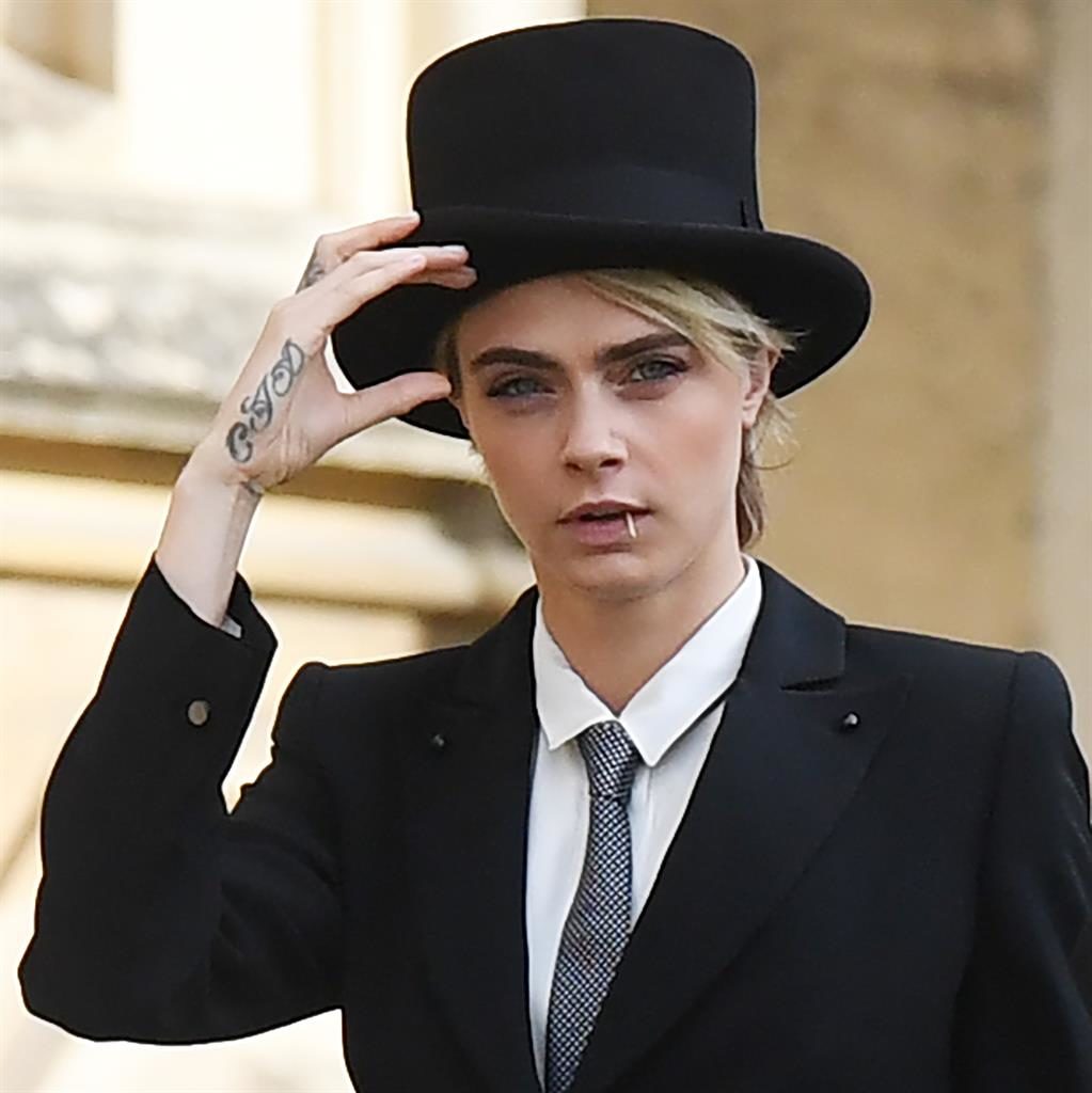 Hats off to her: Cara was not afraid to make a bold wardrobe choice today PICTURES: EPA/AP/GETTY/REX Hats off to her: Cara was not afraid to make a bold wardrobe choice today PICTURES: EPA/AP/GETTY/REX