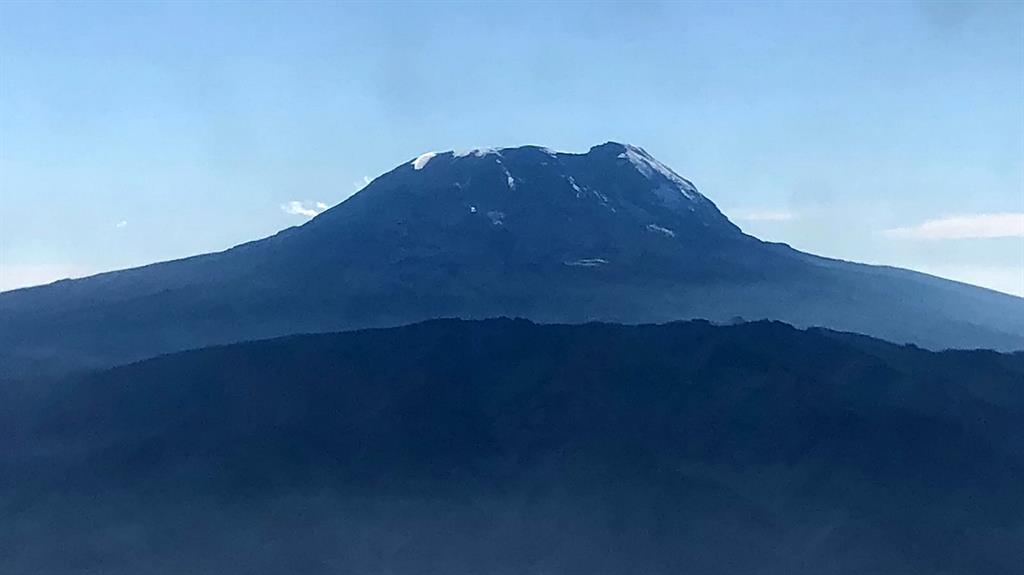 Conquered: Corinne's view of Mount Kilimanjaro as she flew in to begin her unique challenge