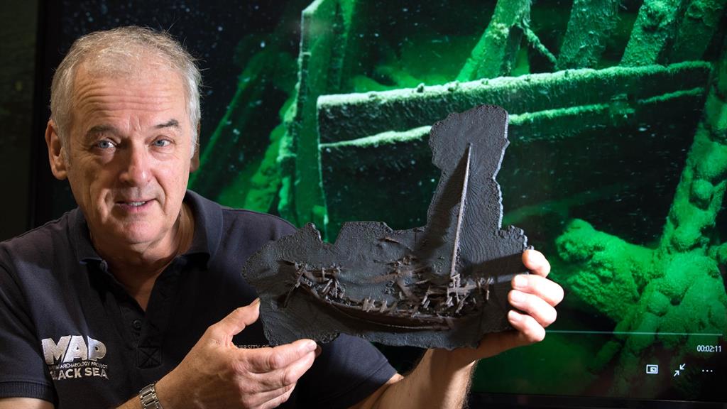 Let it sink in: Prof Jon Adams with a 3D model of the Greek shipwreck PICTURES: PA