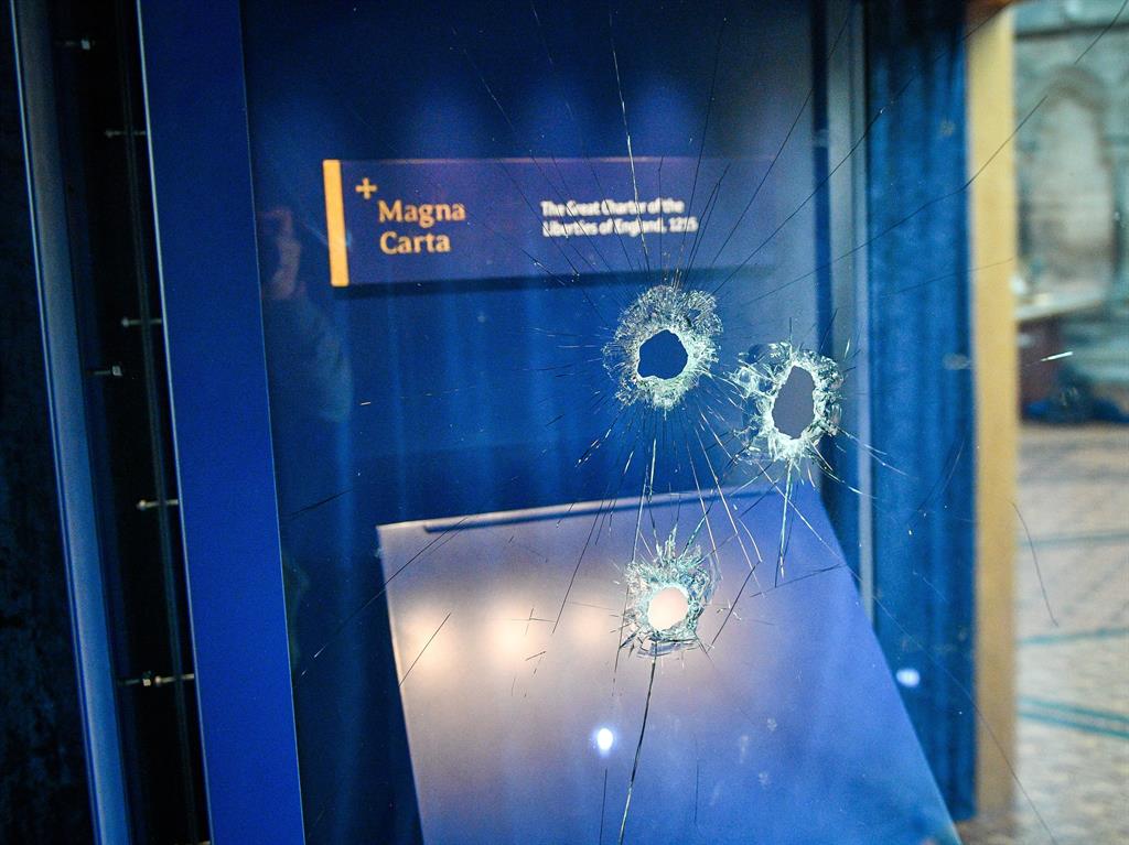 Hammer time: Holes in the glass case that houses the Magna Carta