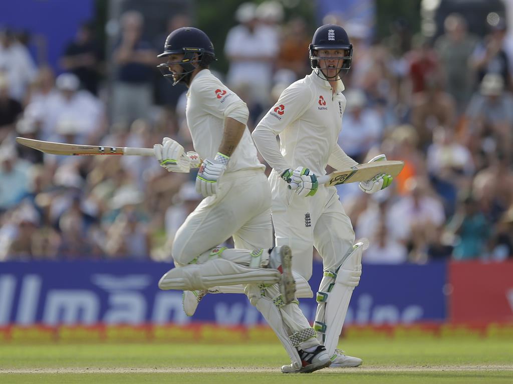 On the board: Keaton Jennings (right) and Ben Foakes run between wickets PICTURES: AP