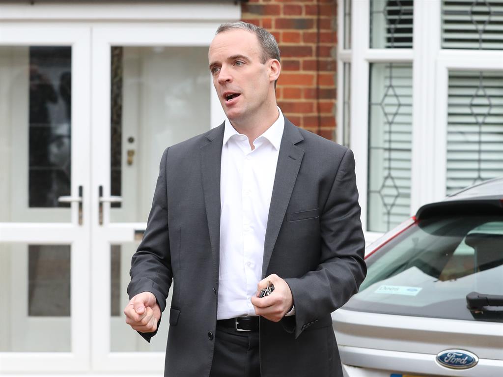 Quit: Dominic Raab outside his Surrey home this morning