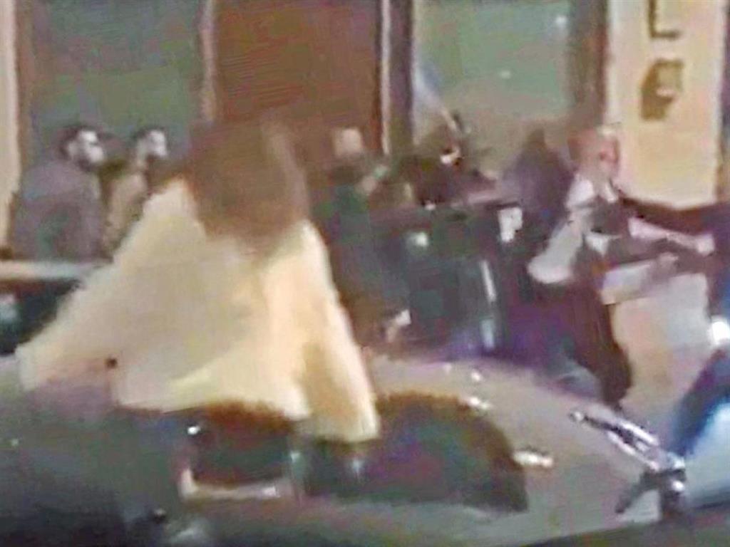 Flashpoint: Mr Simionov (white shirt) grapples with the intruders