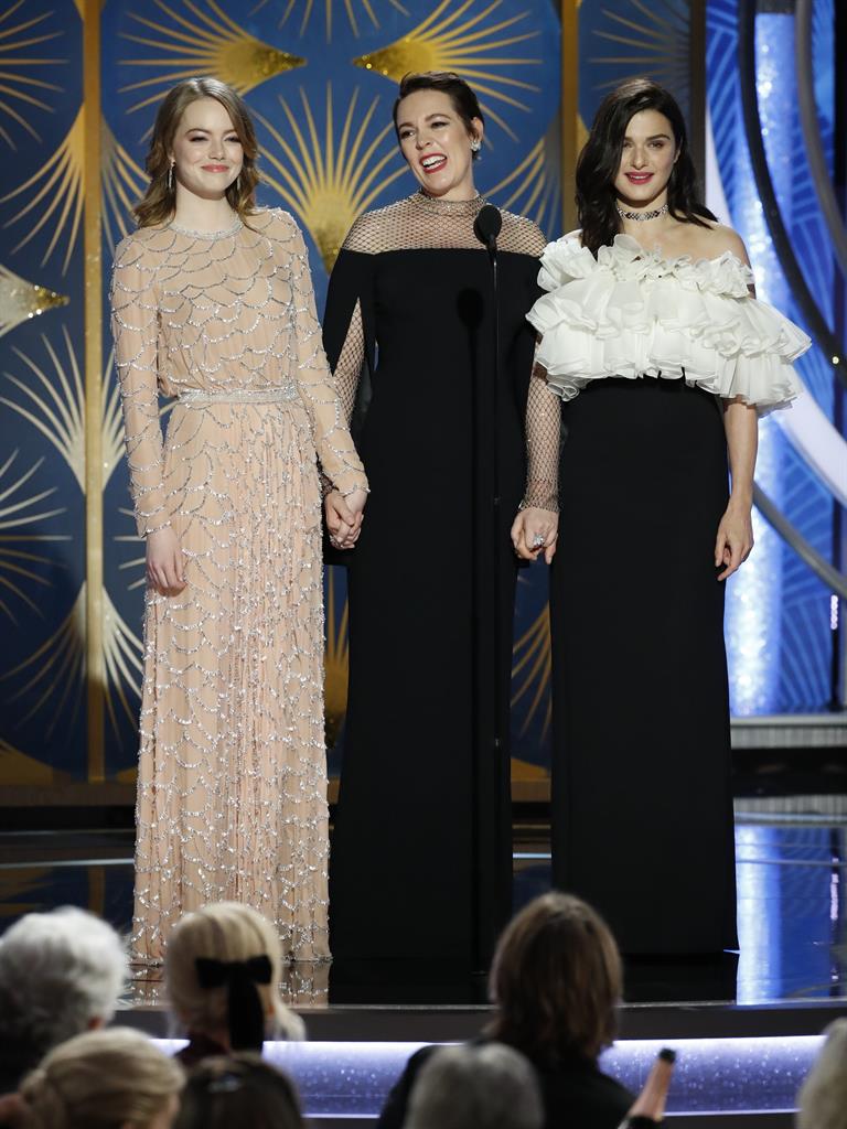 All hail the Queen: Olivia Colman is joined on the stage by her co-stars Emma Stone and Rachel Weisz PICTURE: GETTY