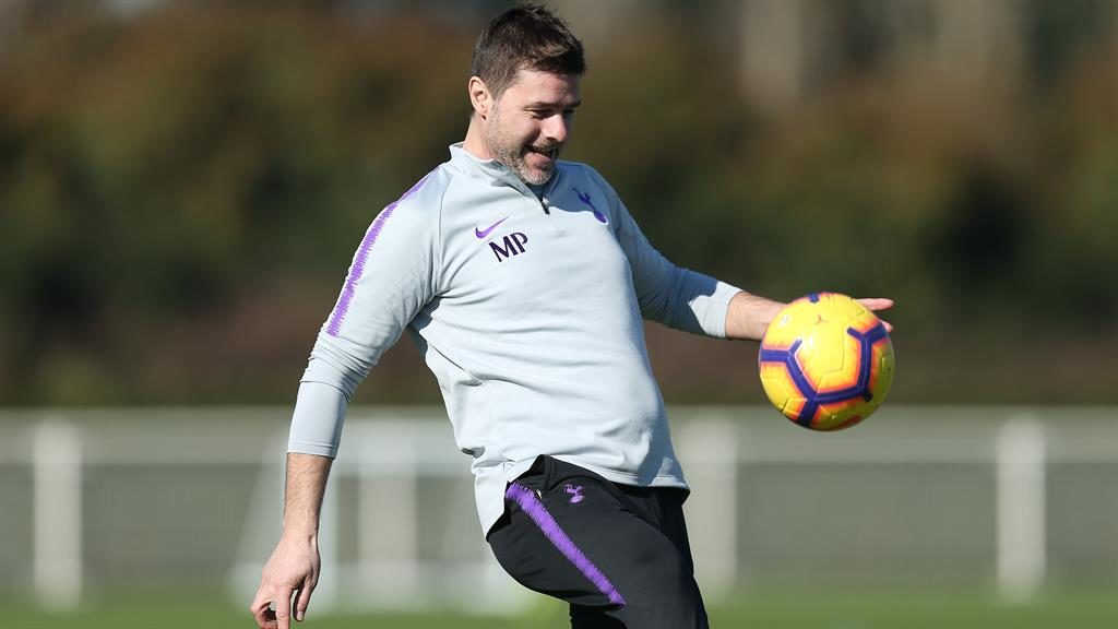 Grin and bear it Spurs boss Pochettino was happy in training yesterday despite being charged by the FA