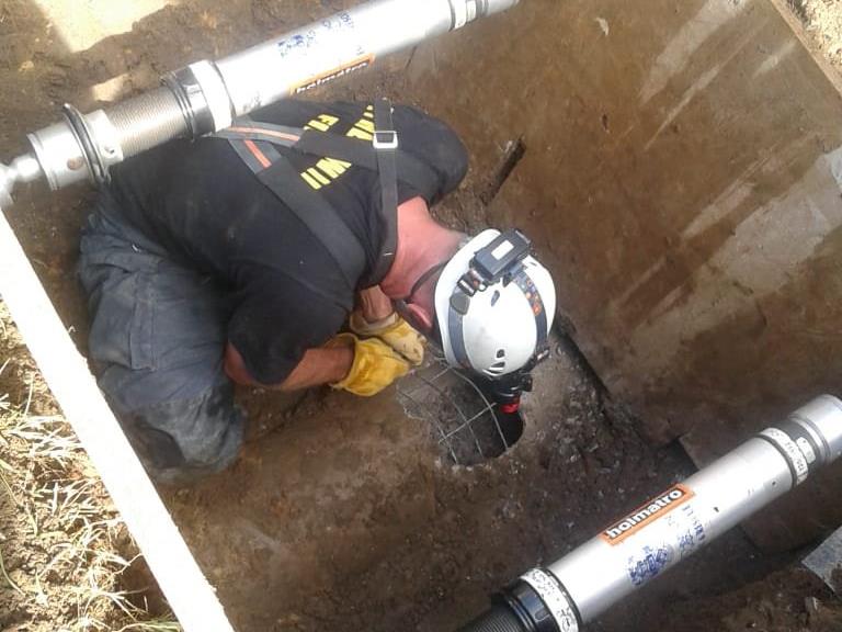 Incredible moment newborn baby is pulled alive from a storm drain in South Africa
