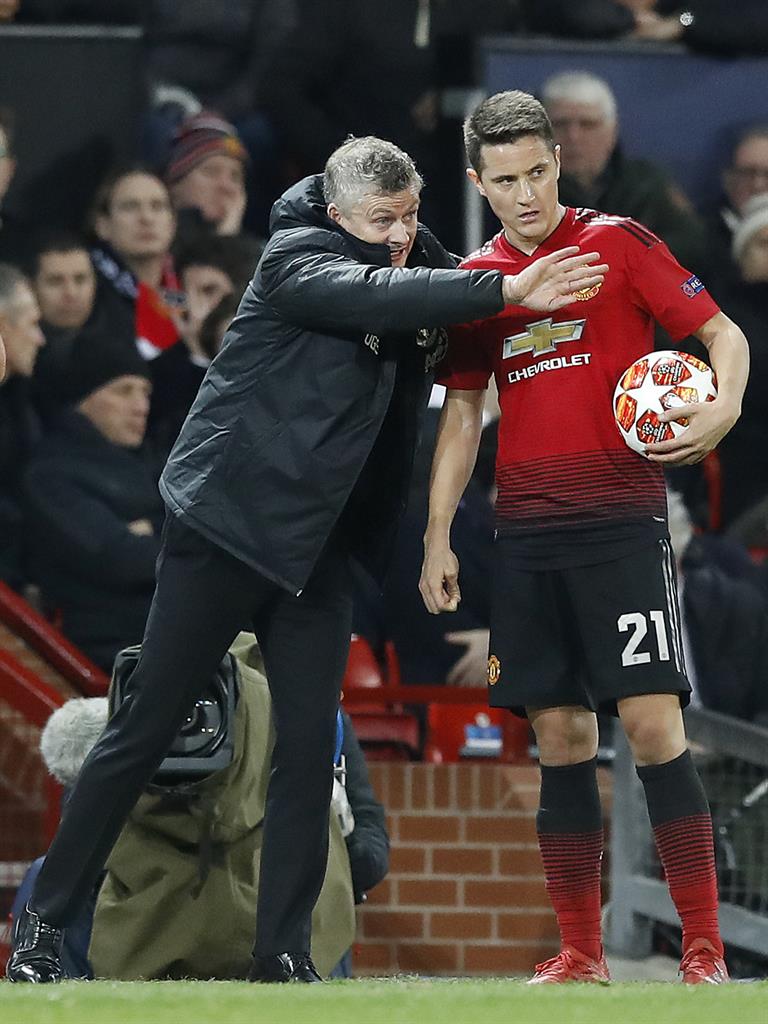 Kick it: Man Utd caretaker manager Ole Gunnar Solskjaer speaks to Ander Herrera during the match at Old Trafford