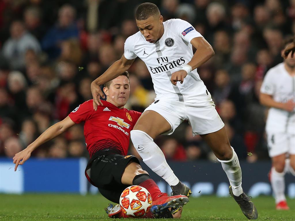 Action man: Herrera (left) competes for the ball with PSG's Kylian Mbappe PICTURES: PA/AP/EPA