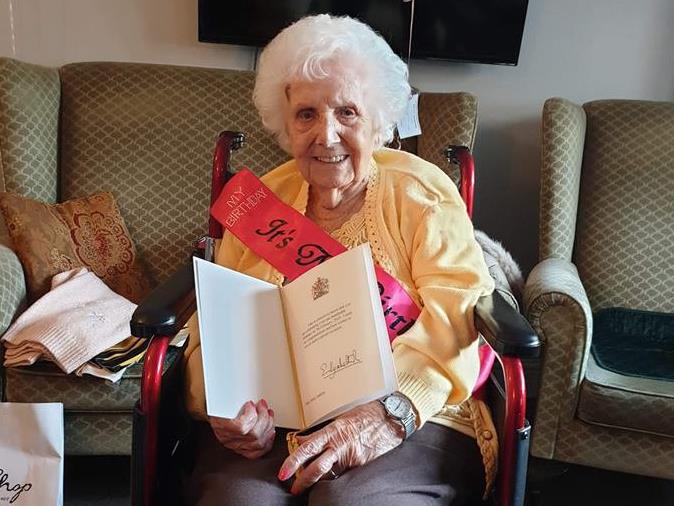 Made it: Doll proudly shows off her birthday card from the Queen PICTURES: SWNS
