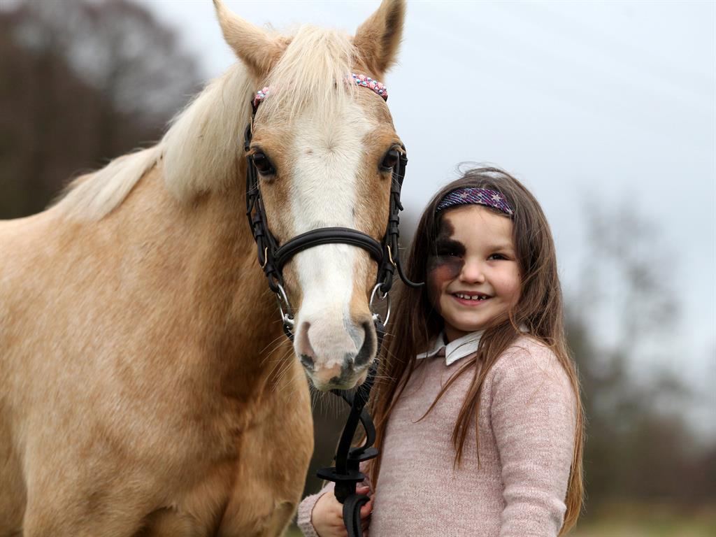Big friends: Rosabella with her horse Rosie PICTURES: SWNS