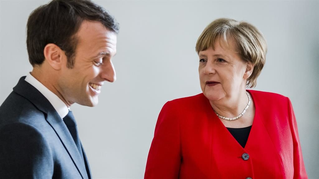 Helping hands French president Emmanuel Macron left speaks with German chancellor Angela Merkel