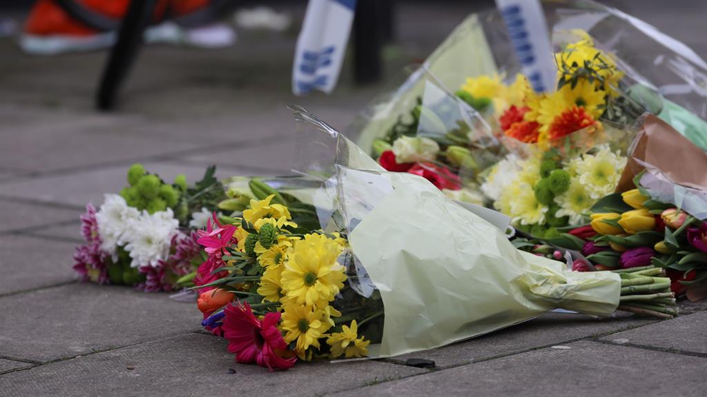 Tributes: Flowers placed at Lanfrey Place, West Kensington, London, where 17-year-old Ayub Hassan was stabbed and later died in hospital PICTURE: PA