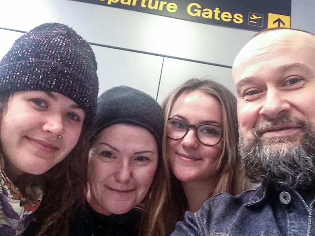 Fond farewell: Izzy (second right) and Beth (left) with their parents Tracy Dodd and David Squire at Manchester Airport, before the sisters went travelling