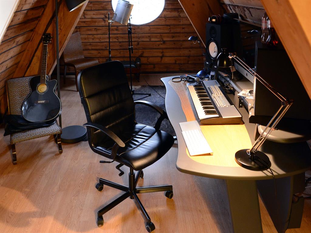 Where the work is done: Stacey’s recording studio, above and main picture, is her ‘sanctuary’; her basement gym, below