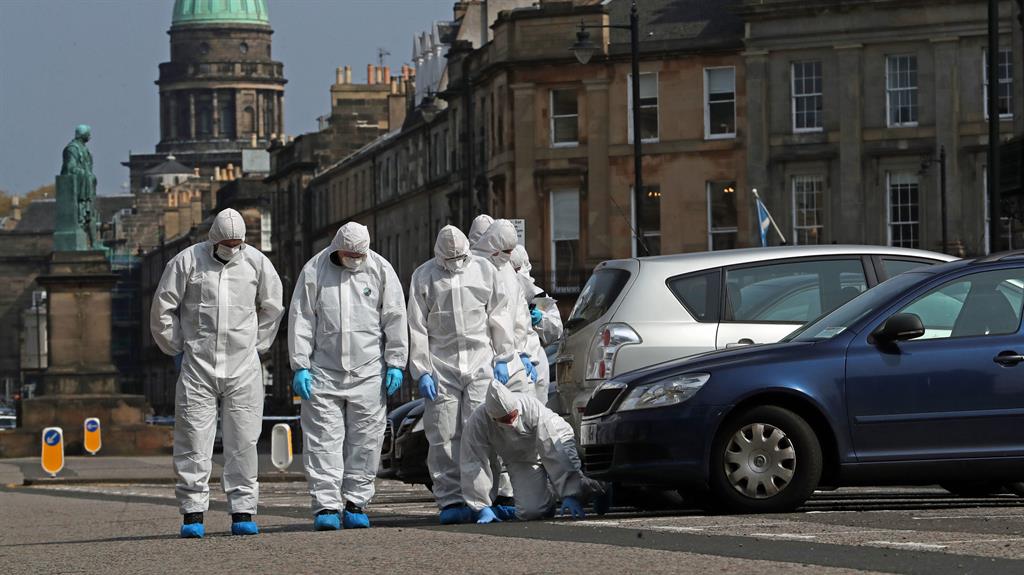 Crime scene: Forensics searching for clues after the shooting: PICTURE: PA