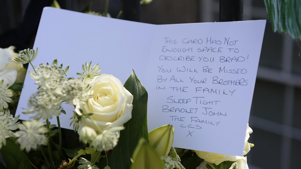 Outpouring of sympathy: Tributes left at the scene close to where Welsh was gunned down PICTURE: SWNS