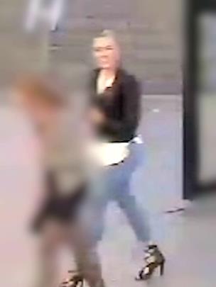 Night out: A CCTV camera captures a blurred image of Sara Zelenak walking in front of One London Bridge not long before the attack PICTURE: PA