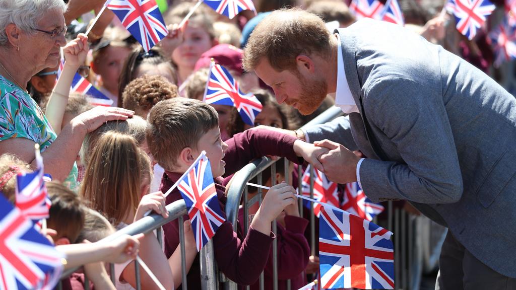 Attentive: Harry stopped to speak to wellwishers, despite not having much sleep