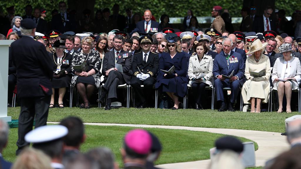 Pin drop: Frank Baugh, who served as a signalman with the Royal Navy, captivates his audience at the Commonwealth War Graves Commission Cemetery, in Bayeux, France PICTURE: PA