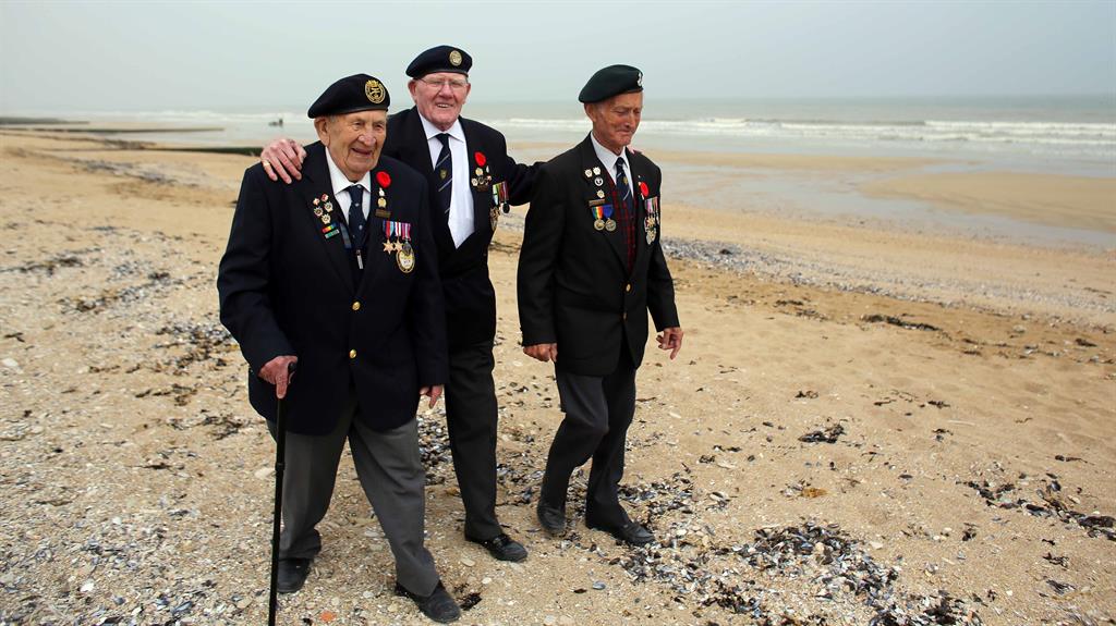 Memory lane: Frank Baugh (centre), 89, with Victor Urch (left) and Derek Whitehead, both 88, on Sword Beach at Colleville-Montgomery PICTURES: GETTY