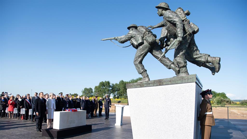 Landmark: French president Emmanuel Macron and Theresa May attend a Franco-British ceremony for the laying of the first stone of a British memorial in Ver-Sur-Mer PICTURE: REX