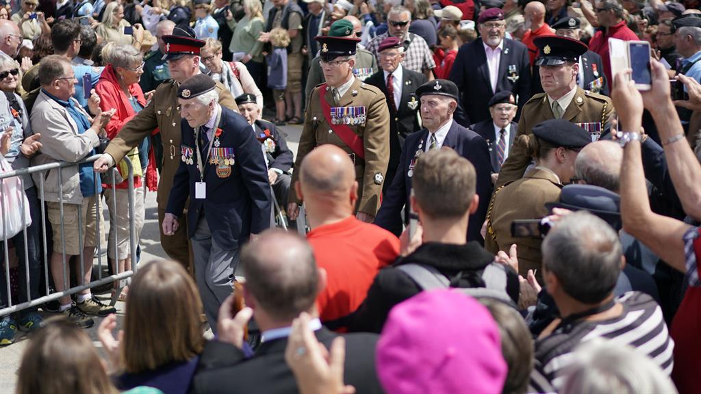 Respect: Veterans walk through the crowds who arrived to commemorate the 75th anniversary in Arromanches Les Bains PICTURE: GETTY