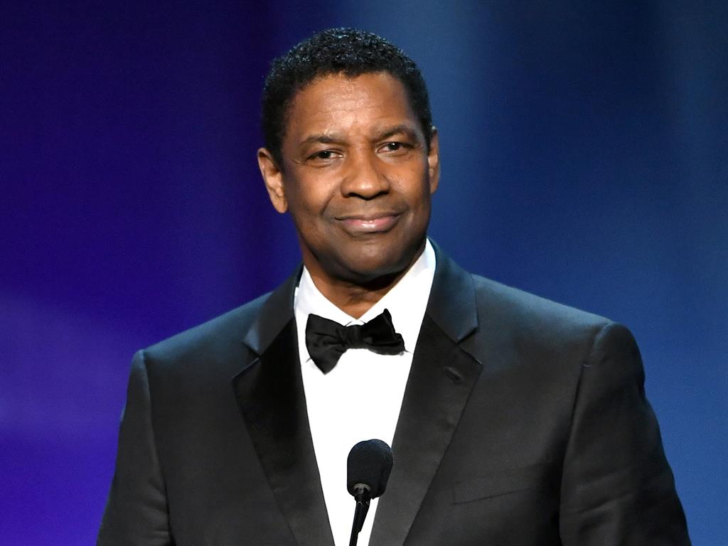 Accolade: Washington accepting his award at the Dolby Theater in Los Angeles PICTURE: REX