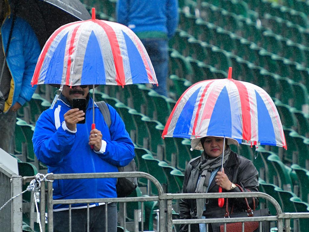 Brolly bad luck: Fans at abandoned cricket match between Sri Lanka and Bangladesh