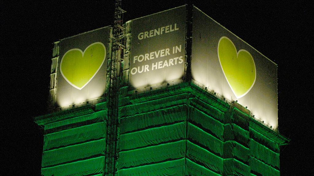 Loud and clear: The ruins of Grenfell Tower were illuminated this morning to commemorate the 75 lives lost PICTURE: REX